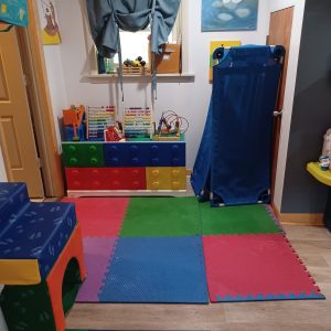 Professional daycare cleaning service sanitizing colorful play area in Chicago childcare center